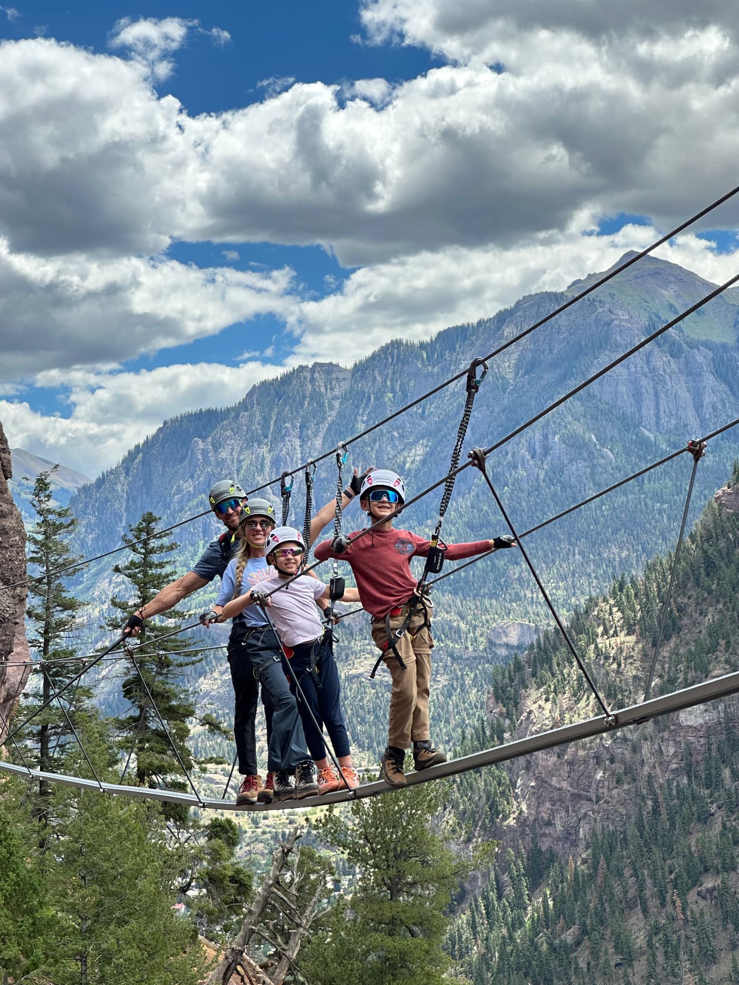 Our family standing together on the Bridge of Heaven on the Gold Mountain Via Ferrata
