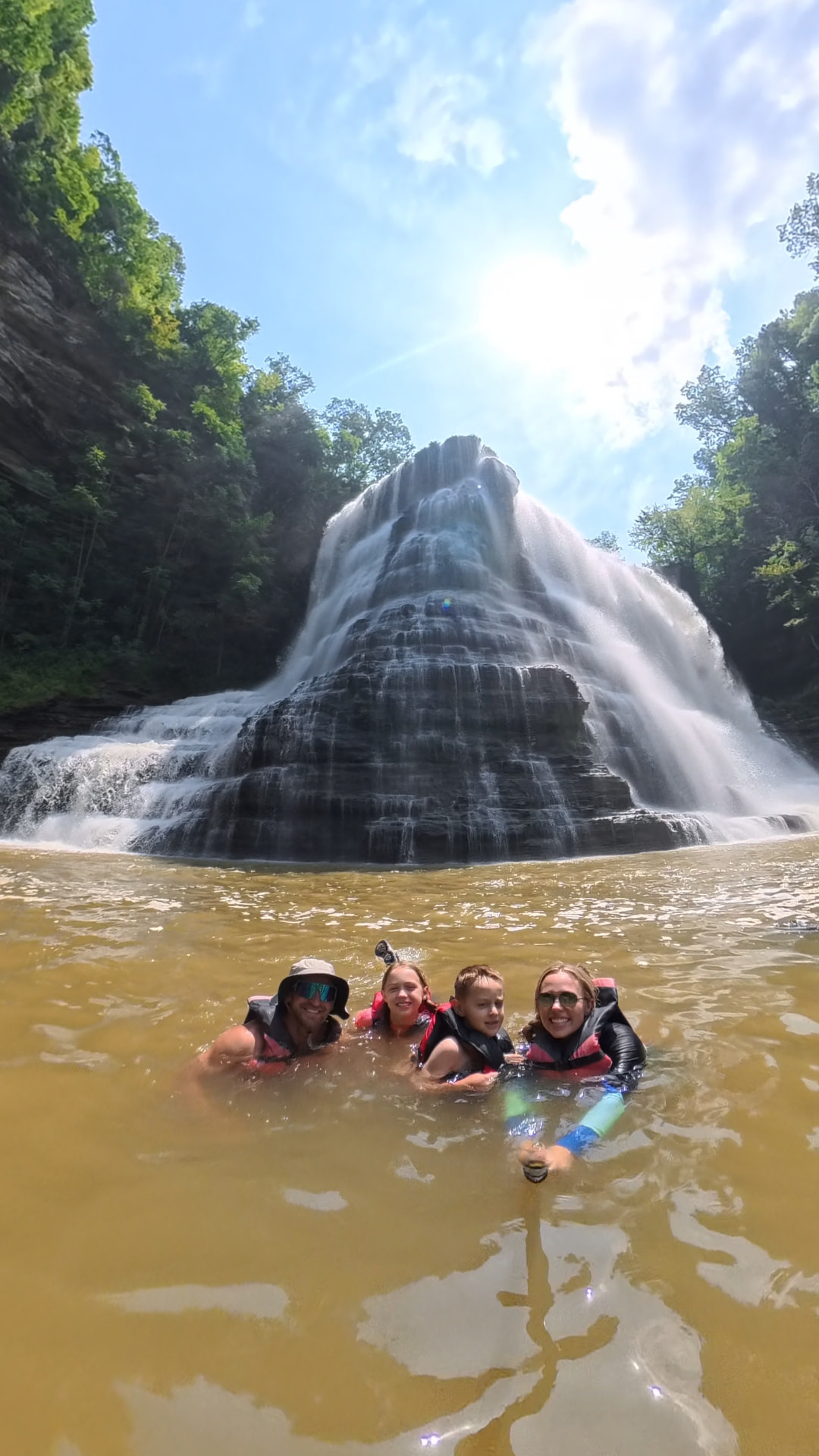 Our family floating at the base of Burgess Falls in Tennessee