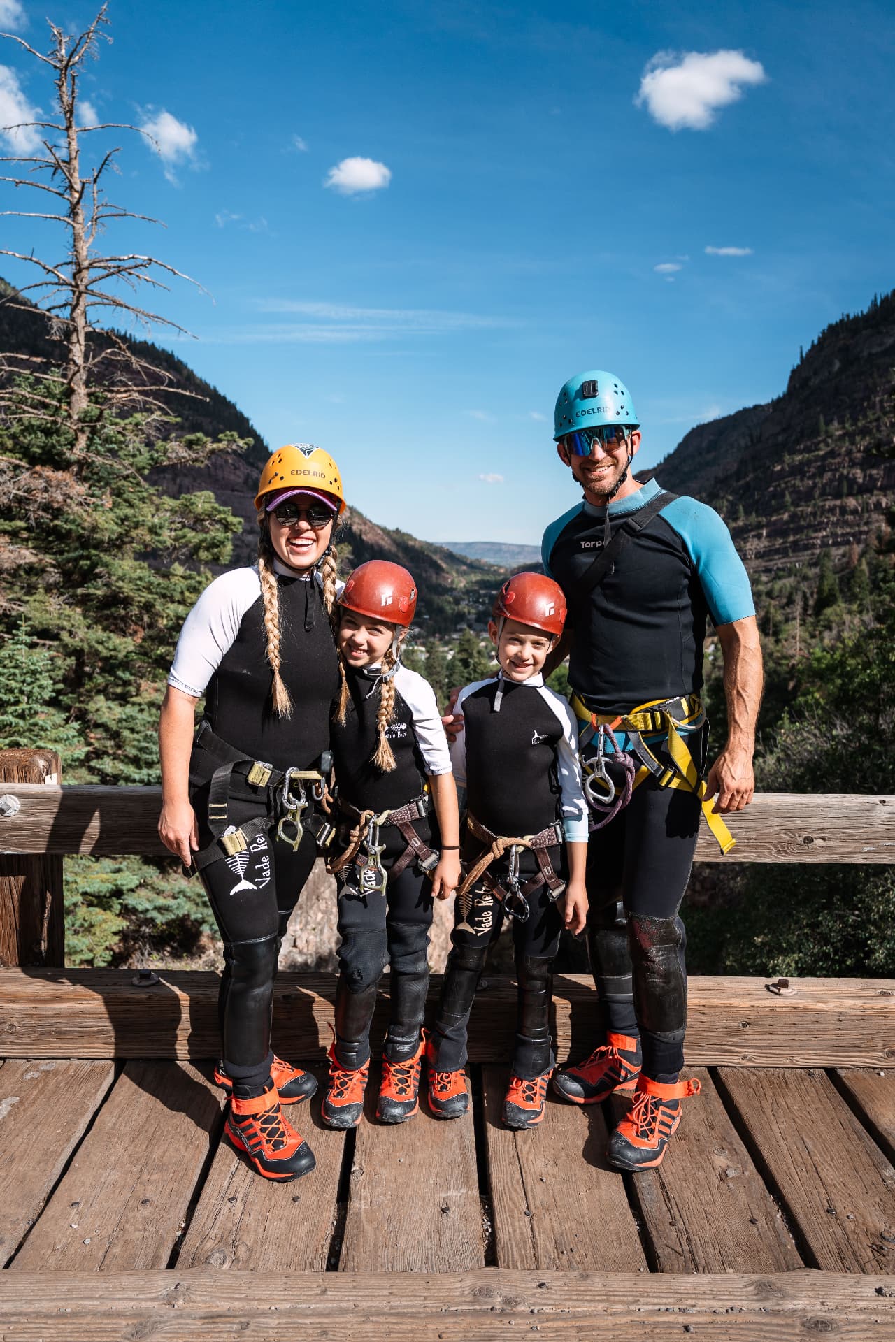 Our family geared up in wetsuits and helmets before canyoning Portland Creek in Ouray, Colorado