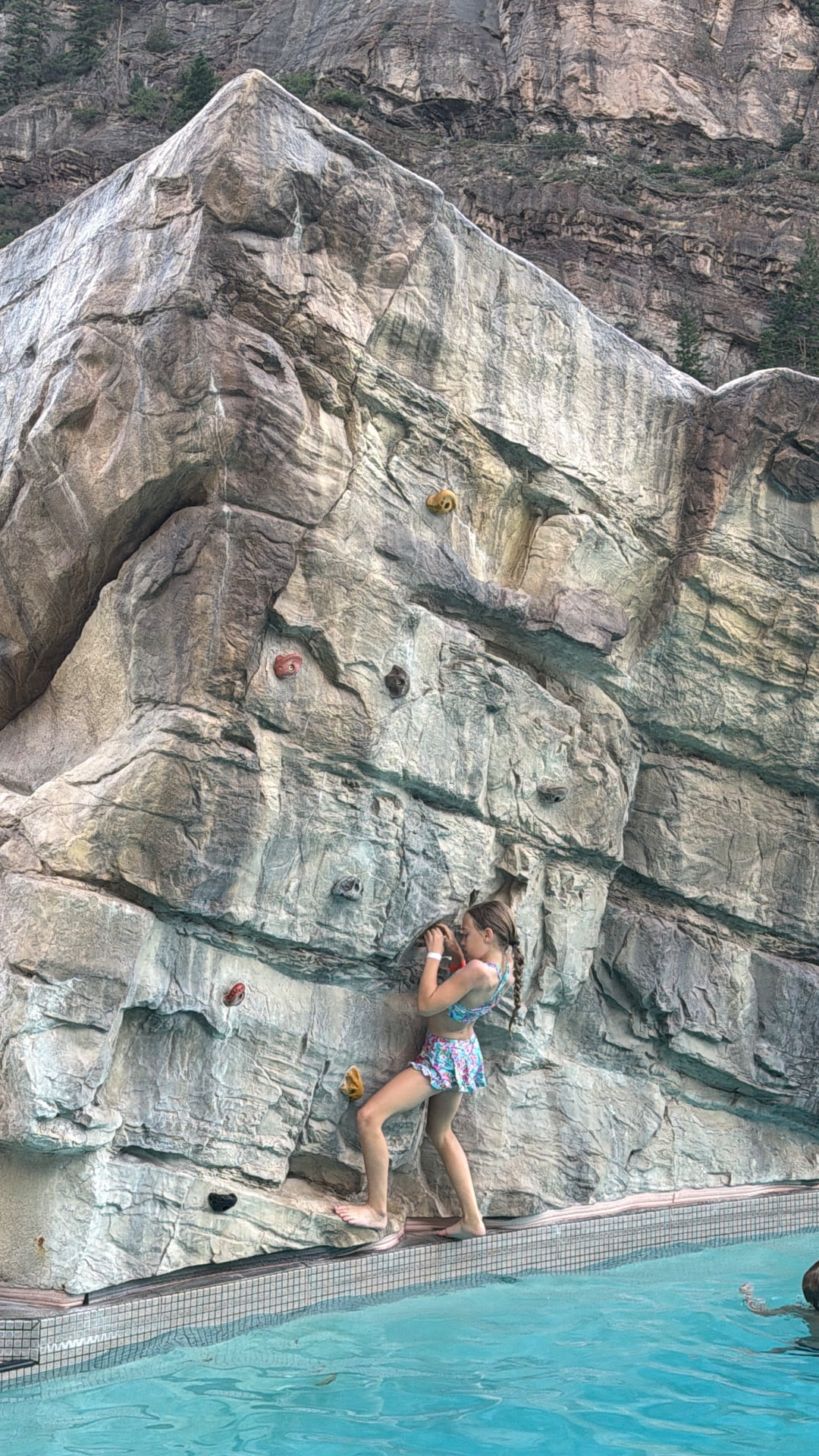 Our daughter climbing the rock wall at the edge of the Ouray Hot Springs Pool