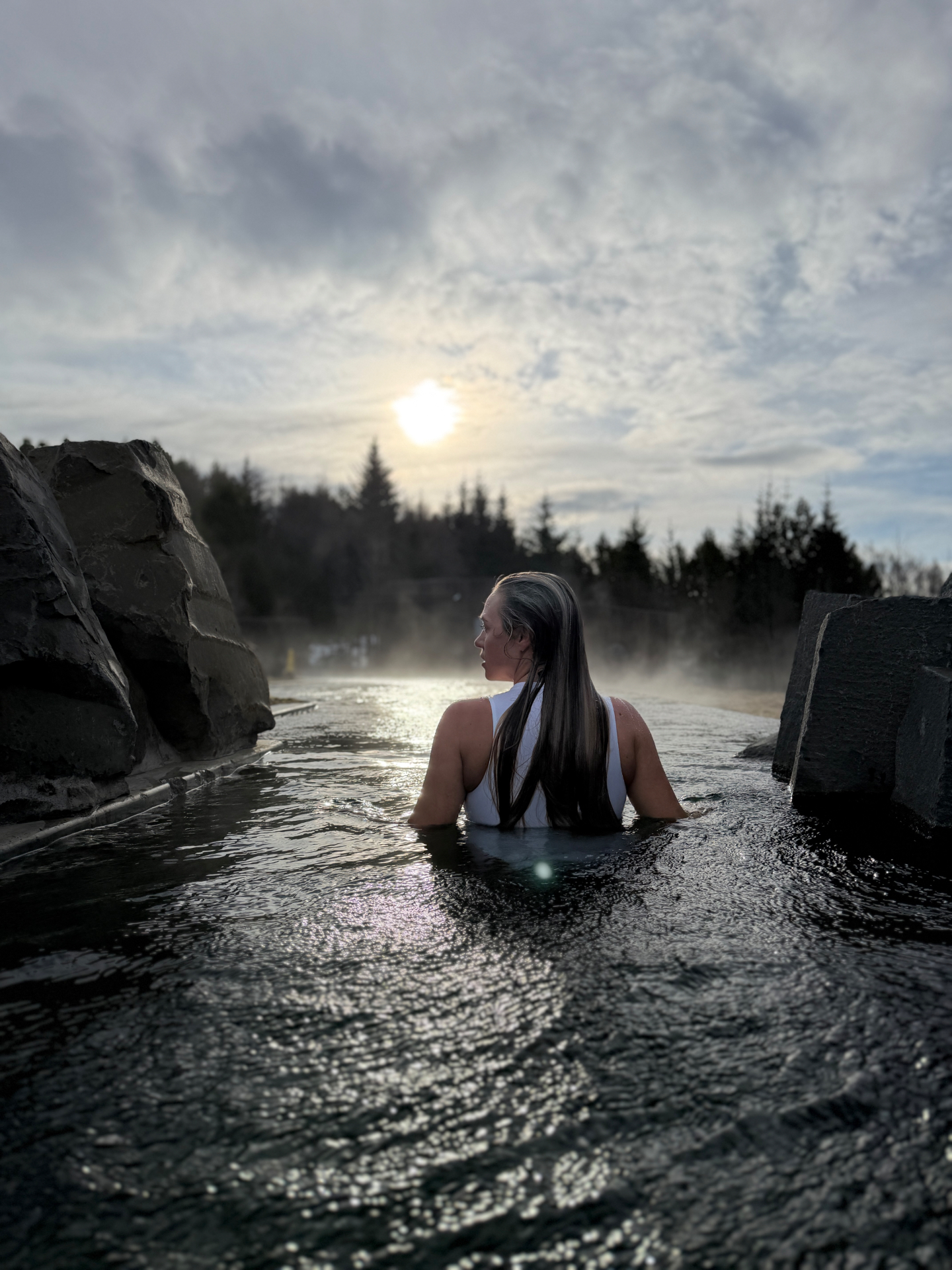 Brittany and Jake soaking in a steaming blue lagoon in Iceland
