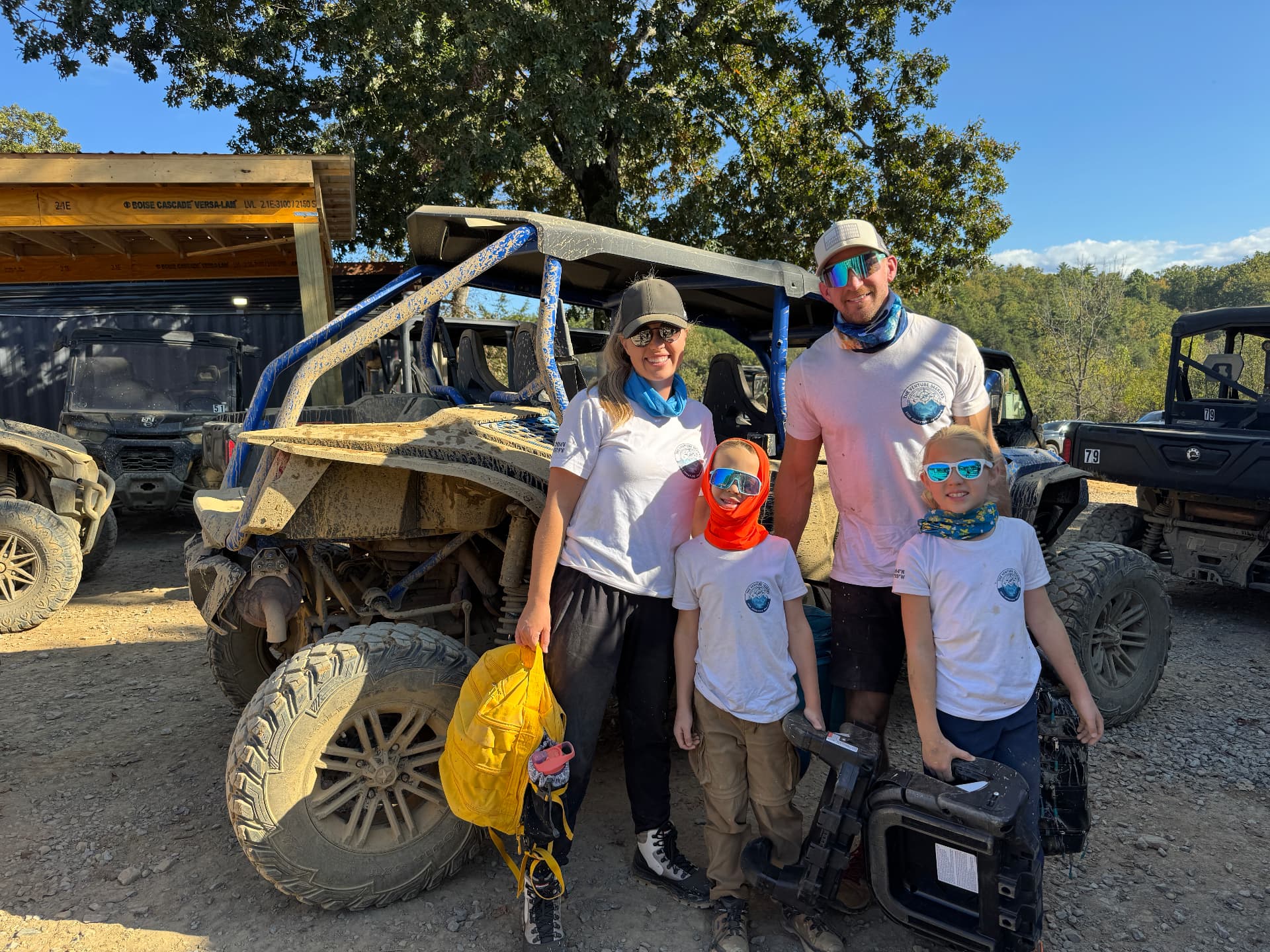 Our whole family covered in dust next to our UTV after the Off-Road Gatlinburg tour