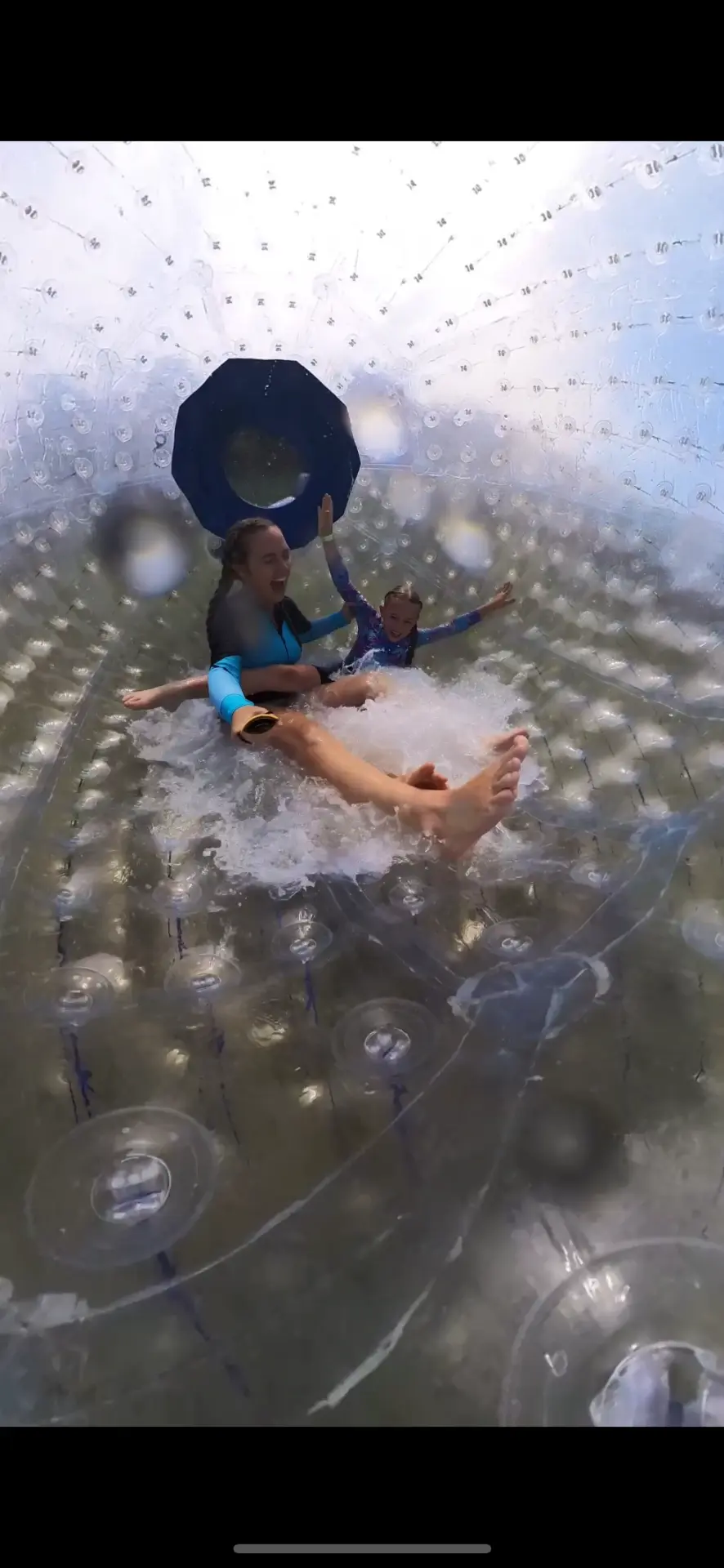 Brittany and Aniston tumbling together inside the zorb ball