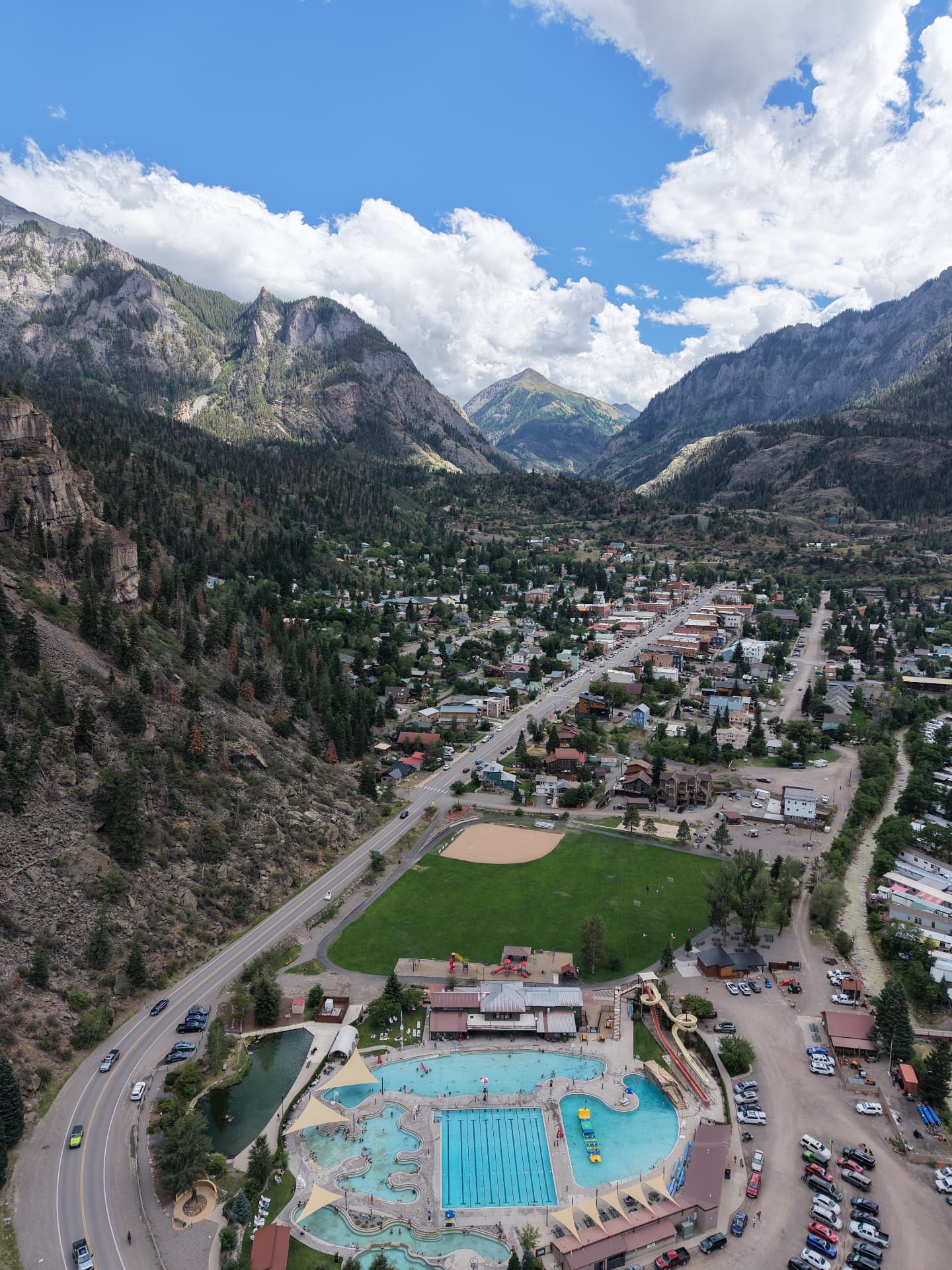 Aerial view of the Ouray Hot Springs Pool surrounded by the San Juan Mountains